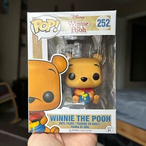 Funko Winnie the Pooh Vinyl Figure with Red and Blue Accents